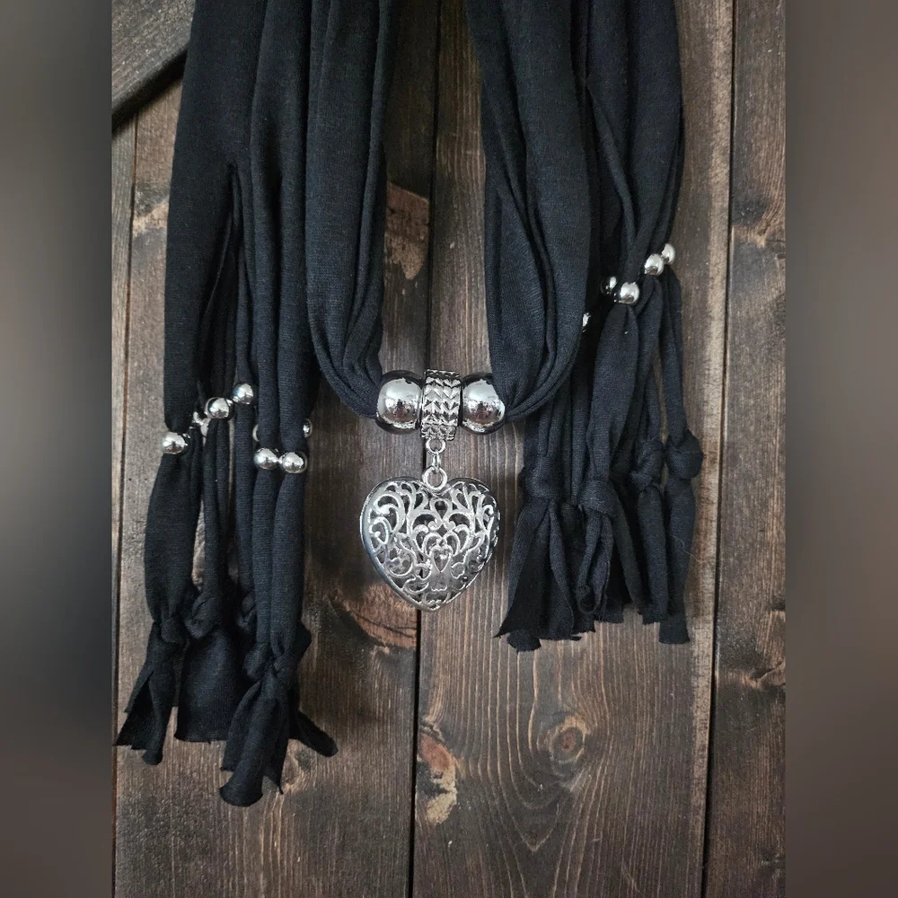 NWT Chic Black and Silver Wrap with Intricate Medallion